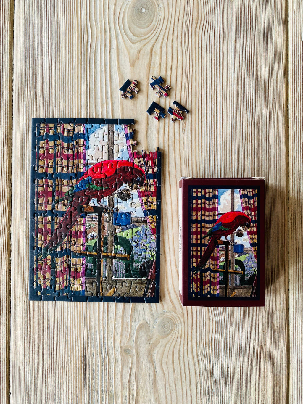 Mini-puzzle Perroquet Rouge assemblé – PENNY PUZZLE chez George Genève